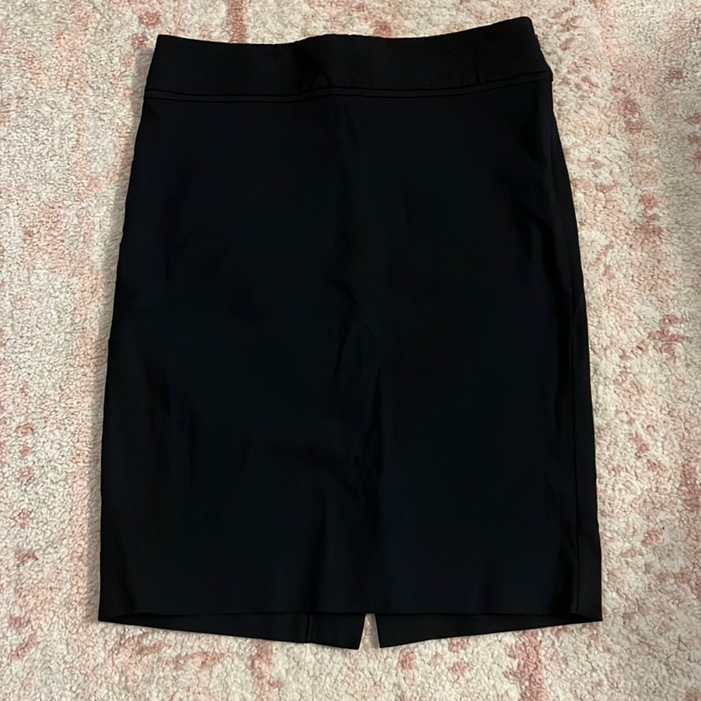 The limited black pencil skirt size 00P with side zipper and back slit